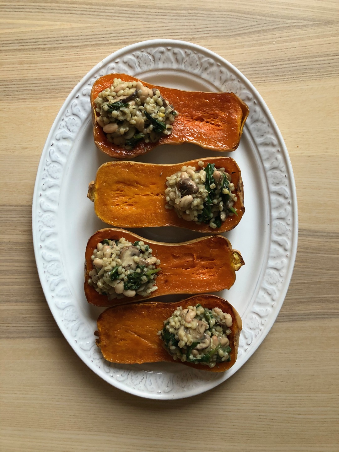 Butternut squash stuffed with barley risotto and mushrooms